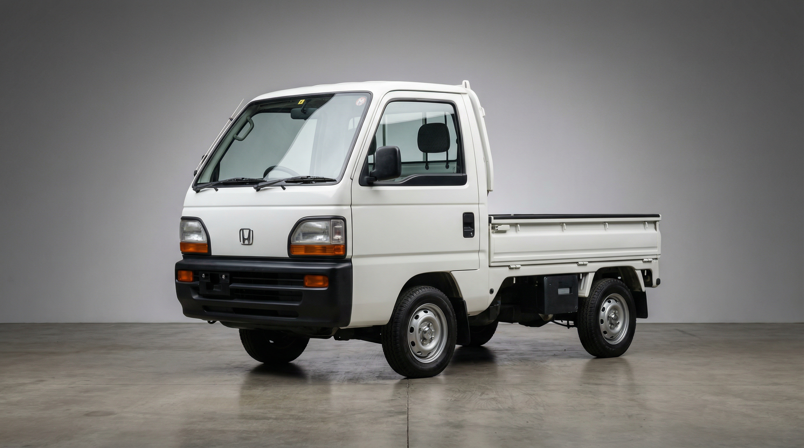 Alpine White Honda Acty with Stock Steel wheels